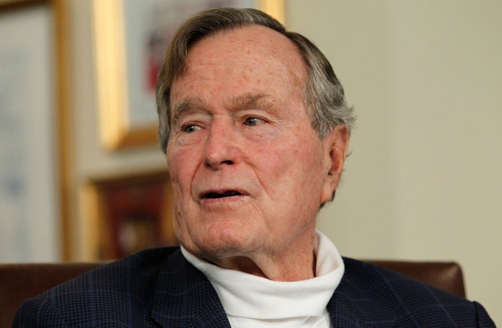 HOUSTON, TX - MARCH 29: Former President George H.W. Bush talks with Republican presidential candidate, former Massachusetts Gov. Mitt Romney at Bush's office on March 29, 2012 in Houston, Texas. Mitt Romney received an endorsement from Former President George H.W. Bush and Barbara Bush during the meeting. (Photo by Tom Pennington/Getty Images)