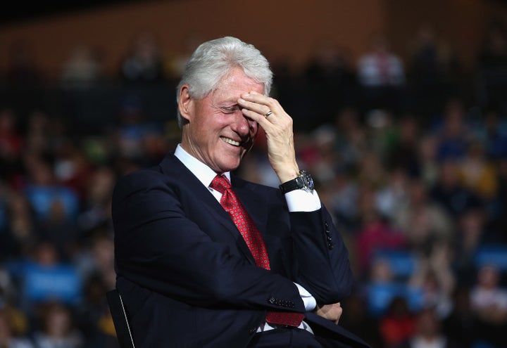 YOUNGSTOWN, OH - OCTOBER 29: Former U.S. President Bill Clinton laughs as U.S. Vice President Joe Biden speaks during a camp