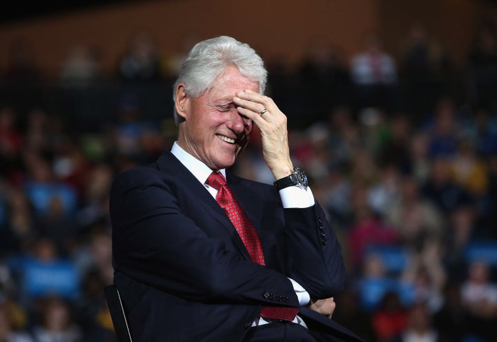 YOUNGSTOWN, OH - OCTOBER 29: Former U.S. President Bill Clinton laughs as U.S. Vice President Joe Biden speaks during a campaign rally on October 29, 2012 in Youngstown, Ohio. President Obama had planned to attend the event but cancelled to return to the White House to monitor developments concerning Hurricane Sandy. Political analysts have predicted Ohio voters could potentially decide the upcoming Presidential election. (Photo by John Moore/Getty Images)