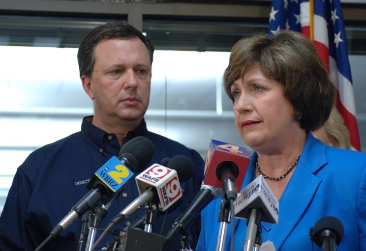 FEMA Undersecretary Michael Brown looks on. New Orleans is being evacuated due to flooding. | Source http://www. photolibra