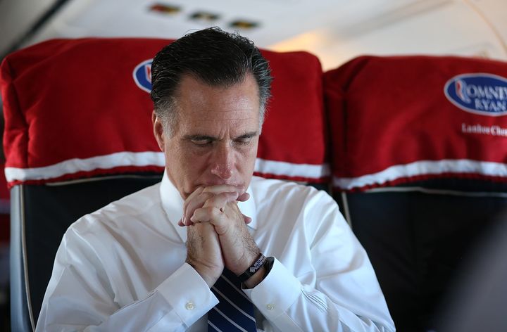 IN FLIGHT, OH - NOVEMBER 02: Republican presidential candidate, former Massachusetts Gov. Mitt Romney sits aboard his campaign plane on November 2, 2012 en route to Milwaukee, Wisconsin. With less than one week to go before election day, Mitt Romney is campaigning in Wisconsin and Ohio. (Photo by Justin Sullivan/Getty Images)