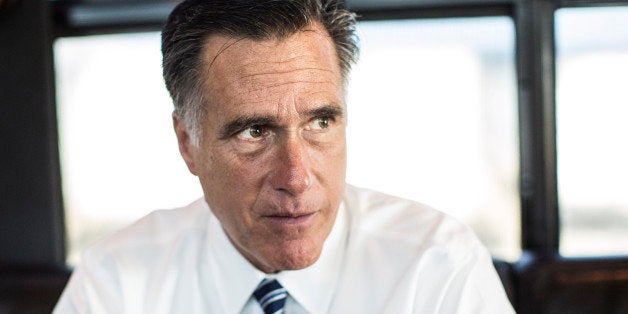 WORTHINGTON, OHIO - OCTOBER 25: Bound for a rally in central Ohio, Republican nominee for President Governor Mitt Romney aboard his campaign bus works with staff, in Worthington, Ohio, Thursday, October, 25, 2012. (Photo by Melina Mara/The Washington Post via Getty Images)