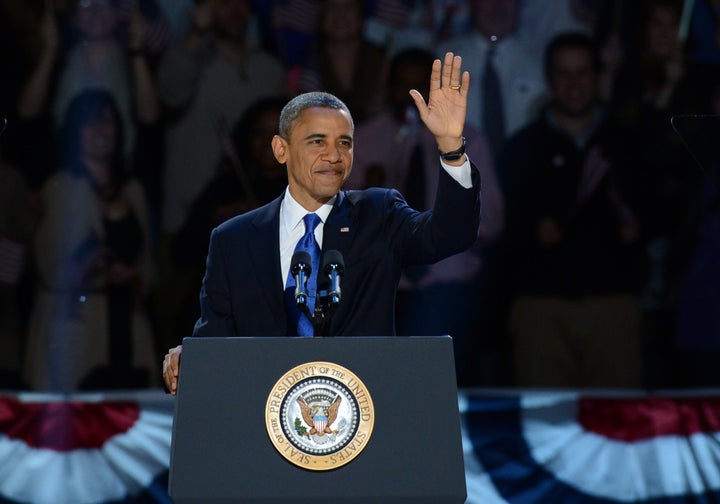 US President Barack Obama arriveS on stage after winning the 2012 US presidential election November 7, 2012 in Chicago, Illinois. Obama swept to re-election, forging history again by defying the dragging economic recovery and high unemployment which haunted his first term to beat Republican Mitt Romney. AFP PHOTO / Saul LOEB (Photo credit should read SAUL LOEB/AFP/Getty Images)