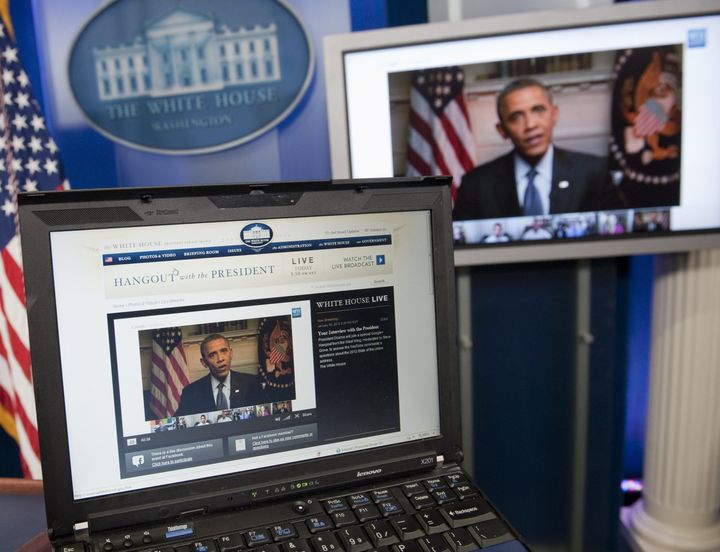 US President Barack Obama participates in an interview with YouTube and Google from the Roosevelt Room of the White House in Washington, DC, January 30, 2012, as seen on a laptop in the Brady Press Briefing Room. The interview, held through a Google+ Hangout, marks the first completely virtual interview of a US President from the White House. AFP PHOTO / Saul LOEB (Photo credit should read SAUL LOEB/AFP/Getty Images)