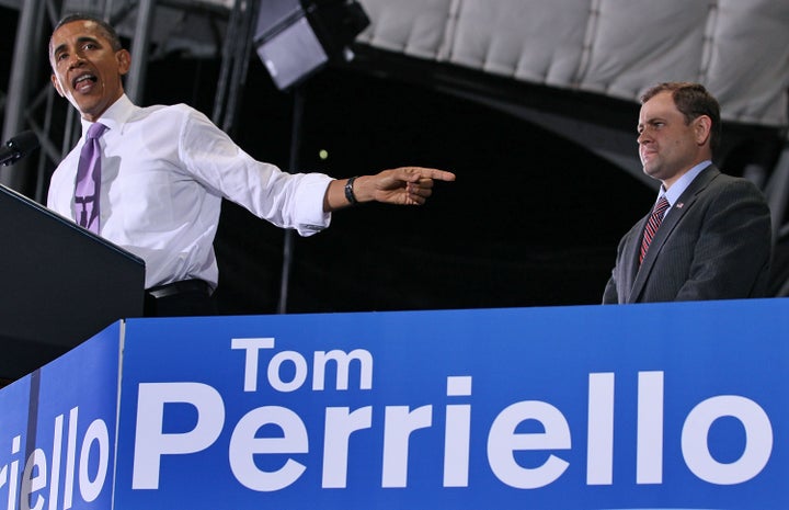 CHARLOTTESVILLE, VA - OCTOBER 29: U.S. President Barack Obama speaks while flanked by Rep. Tom Perriello (D-VA) during a campaign rally, on October 29, 2010 in Charlottesville, Va. Recent polls show Rep. Perriello trailing challenger Virginia State Senator Robert Hurt (R-VA). With mid-term elections approaching, President Obama has been campaigning for Democrats who may be in jeopardy of losing their seat. (Photo by Mark Wilson/Getty Images)