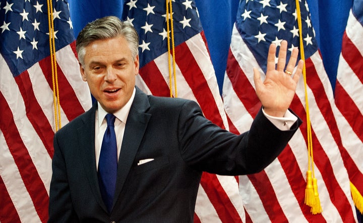 Former Utah Gov. Jon Huntsman waves to a room full of reporters as he leaves after anouncing the suspension of his campaign for the GOP presidential nomination January 16, 2012 and endorses Mitt Romney at the Myrtle Beach Convention Center in Myrtle Beach, South Carolina. Huntsman, the former US ambassador to China, ended his struggling presidential bid Monday and called on Republicans to unite in support of frontrunner Mitt Romney. AFP Photo/Paul J. Richards (Photo credit should read PAUL J. RICHARDS/AFP/Getty Images)