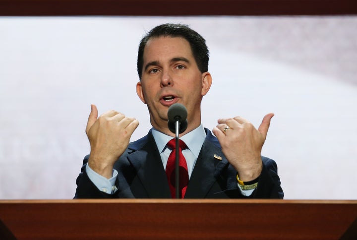 TAMPA, FL - AUGUST 26: Wisconsin Gov. Scott Walker speaks at the podium ahead of the Republican National Convention at the Tampa Bay Times Forum on August 26, 2012 in Tampa, Florida. The RNC is scheduled to convene on August 27 and will hold its first full-day session on August 28 as Tropical Storm Isaac threatens disruptions due to its proximity to the Florida peninsula. (Photo by Chip Somodevilla/Getty Images)