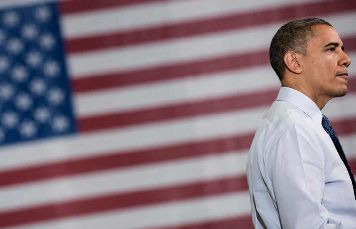 US President Barack Obama pauses while speaking at a Rodon Group manufacturing facility on November 30, 2012 in Hatfield, Pen