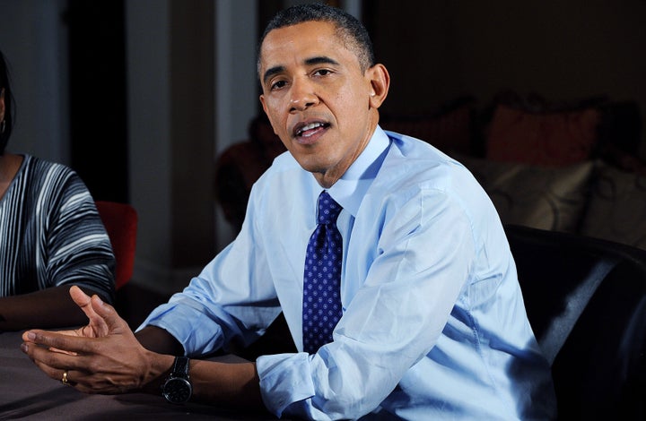 FALLS CHURCH, VA - DECEMBER 6: U.S. President Barack Obama speaks while visiting a home to discuss his plan to extend tax cuts for 98 percent of Americans December 6, 2012 in Falls Church, Virginia. Obama went to the home of Tiffany and Richard Santana in suburban Virginia to push for the administrations plan to come to an agreement before the 'fiscal cliff' at the beginning of the year. (Photo by Olivier Douliery-Pool/Getty Images)