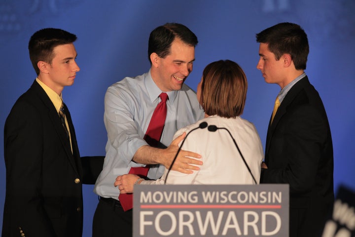 WAUKESHA, WI - JUNE 05: Wisconsin Governor Scott Walker greets his wife Tonette and sons Alex and Matt at an election-night