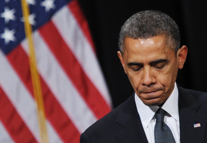 US President Barack Obama pauses as he speaks during a memorial service for the victims and relatives of the Sandy Hook Elementary School shooting on December 16, 2012 in Newtown, Connecticut. Twenty-six people were killed when a gunman entered Sandy Hook Elementary and began a shooting spree. AFP PHOTO/Mandel NGAN (Photo credit should read MANDEL NGAN/AFP/Getty Images)