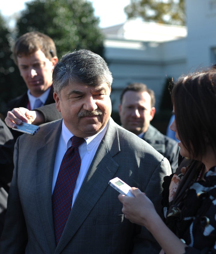 American Federation of Labor and Congress of Industrial Organizations (AFL–CIO) President Richard Trumka (L) speaks to report