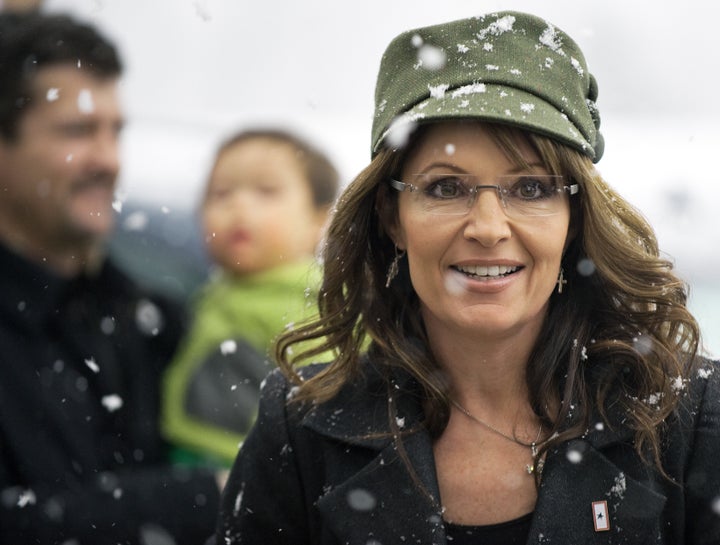 Former Alaska Governor and Republican vice presidential candidate Sarah Palin arrives to sign copies of her recently released