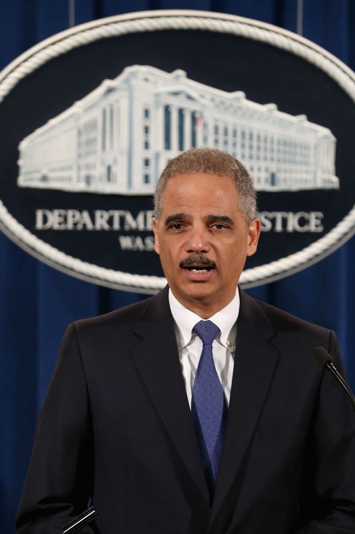 WASHINGTON, DC - FEBRUARY 05: U.S. Attorney General Eric Holder leads a news conference with attorneys general from eight states and the District of Columbia at the Department of Justice February 5, 2013 in Washington, DC. Holder announced that the United States is bringing a civil lawsuit against the ratings agency Standards & Poor's and its parent company, McGraw-Hill Companies, over its pre-fiscal crisis bond ratings. (Photo by Chip Somodevilla/Getty Images)