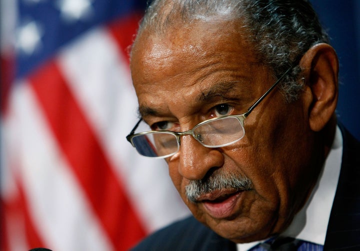 WASHINGTON - SEPTEMBER 12: House Judiciary Chairman John Conyers (D-MI) (L) talks about helping hurricane ravaged Haiti duri