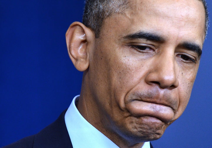 US President Barack Obama pauses as he answers a question about sequestration at the White House in Washington on March 1, 2013 following a meeting with US Speaker of the House John Boehner and Congressional leaders. Obama branded the automatic budget cuts about to slam into the US economy as 'dumb' and 'unnecessary' but blamed Republicans for the failure to avert them. 'These cuts will hurt our economy, will cost us jobs and to set it right both sides need to be able to compromise,' Obama said, on the day $85 billion in cuts go into force after lawmakers failed to reach a deficit-cutting deal. AFP PHOTO/Jewel Samad (Photo credit should read JEWEL SAMAD/AFP/Getty Images)