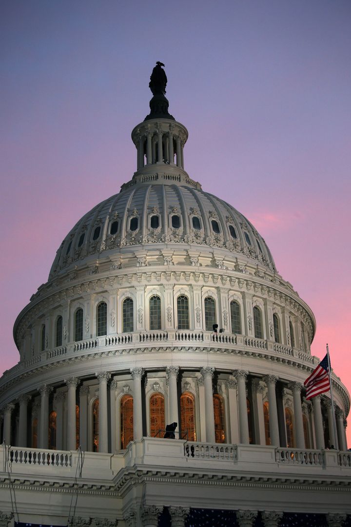 WASHINGTON, DC - JANUARY 21: The sun rises over the Capitol dome before the presidential inauguration on the West Front of the U.S. Capitol January 21, 2013 in Washington, DC. Barack Obama was re-elected for a second term as President of the United States. (Photo by John Moore/Getty Images)