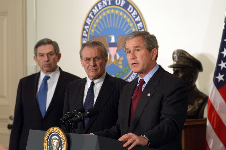 ARLINGTON, VA - MARCH 25: U.S. President George W. Bush (R) announced the $74.7 billion wartime supplemental budget request next to Secretary of Defense Donald H. Rumsfeld (C) and Deputy Secretary of Defense Paul Wolfowitz (L) at the Pentagon March 25, 2003 in Arlington, Virginia. Bush visited the Pentagon to meet with senior defense leadership and to announce the supplemental request, which once appropriated by Congress, will pay for the direct costs of Operation Iraqi Freedom and the global war against terror. (Photo by R.D. Ward/DoD/Getty Images)