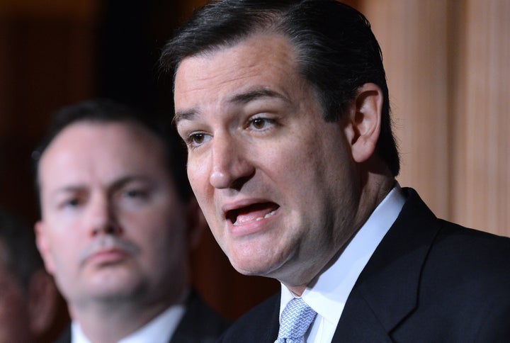 US Senator Ted Cruz R-TX, speaks as Senator Mike Lee, R-Utah, looks on during a press conference on defunding 'Obamacare' on the Capitol Hill in Washington, DC, on March 13, 2013. Even as he set out to woo lawmakers on Capitol Hill, including Republican foes, President Obama called for an approach that restores fiscal stability but also protects healthcare for the poor and the elderly and shields the middle class. AFP PHOTO/Jewel Samad (Photo credit should read JEWEL SAMAD/AFP/Getty Images)