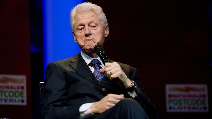 Former US president Bill Clinton grimaces as he speaks during the Goed Geld Gala (''Good Money Gala''), organized by a Dutch charity lottery, at the royal Concert building in Amsterdam, on February 13, 2013. AFP PHOTO/ANP/ ROBIN UTRECHT netherlands out (Photo credit should read ROBIN UTRECHT/AFP/Getty Images)