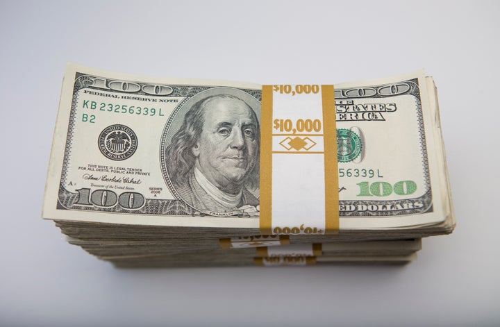 Stacks of U.S. $100 bills are arranged for a photograph in New York, U.S., on Thursday, Feb. 7, 2013. The U.S. dollar advanced in trading today to the highest in almost three weeks against a basket of major currencies. Photographer: Scott Eells/Bloomberg via Getty Images