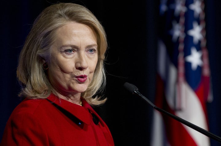 Former Secretary of State Hillary Clinton speaks after receiving awards from Secretary of Defense Leon Panetta and Chairman of the Joint Chiefs Martin Dempsey during a ceremony at the Pentagon in Washington, DC, February 14, 2013. AFP PHOTO / Saul LOEB (Photo credit should read SAUL LOEB/AFP/Getty Images)