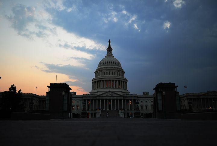 (FILES): This July 29, 2011 file photo shows the US Capitol Building dome at dusk in Washington, DC. Standard & Poor's cut the US credit rating for the first time in history on Friday, August 5, 2011, saying the country's politicians are increasingly unable to come to grips with its massive fiscal deficit and debt load. AFP Photo / Files / Jewel Samad (Photo credit should read JEWEL SAMAD/AFP/Getty Images)