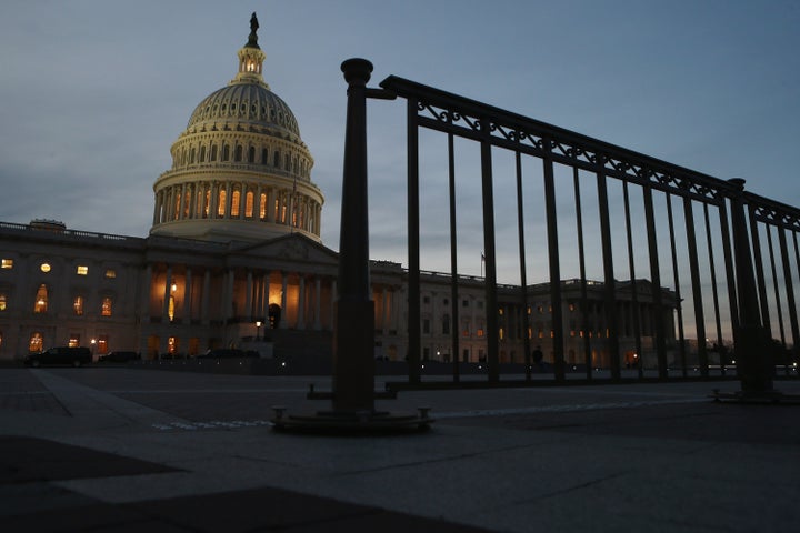 WASHINGTON, DC - FEBRUARY 12: The sun sets on the U.S. Capitol building ahead of President Barack Obama's State of the Union