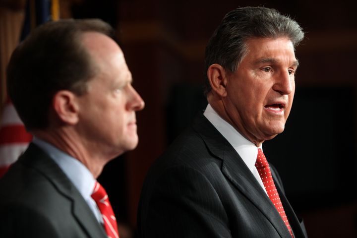 WASHINGTON, DC - APRIL 10: Sen. Pat Toomey (R-PA) (L) and Sen. Joe Manchin (D-WV) speak to the press about background checks for gun purchases, in the U.S. Capitol building April 10, 2013 in Washington DC. The pair is proposing a bipartisan compromise, a proposal to be voted on as an amendment that would expand background checks to firearms sales at gun shows and on the Internet. (Photo by Allison Shelley/Getty Images)