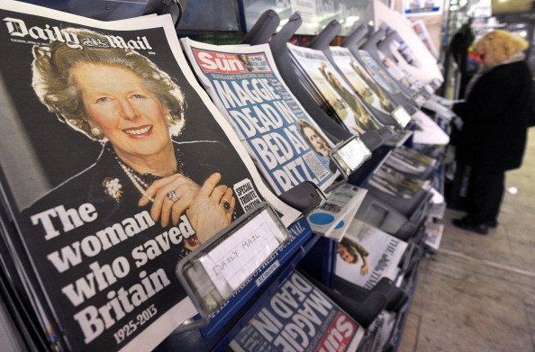 Newspapers with front page coverage on the death of former British prime minister Margaret Thatcher are displayed on news stands in central London on April 9, 2013. Britain will hold the funeral of former prime minister Margaret Thatcher on Wednesday April 17 with Queen Elizabeth II leading the mourners, officials said, as the country wrestled with deeply divided views of the 'Iron Lady.' AFP PHOTO/CARL COURT (Photo credit should read CARL COURT/AFP/Getty Images)