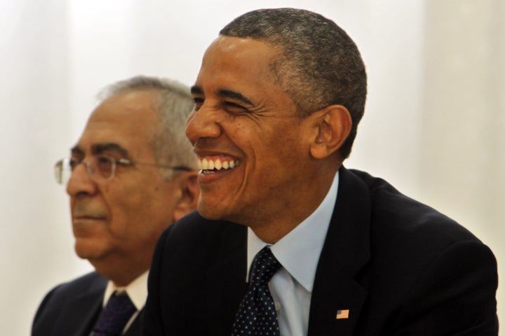 RAMALLAH, WEST BANK - MARCH 21: U.S. President Barack Obama (R) and Palestinian Prime Minister Salam Fayad visit Al Bera Youth Center March 21, 2013 in Ramallah, the West Bank. This is Obama's first visit as president to the region and his itinerary includes meetings with the Palestinian and Israeli leaders as well as a visit to the Church of the Nativity in Bethlehem. (Photo by Alaa Badarneh-Pool/Getty Images)