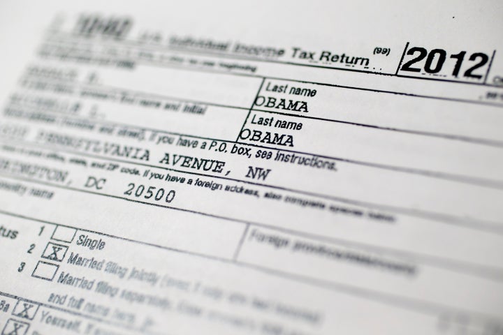 A copy of the U.S. Department of the Treasury Internal Revenue Service (IRS) 1040 Individual Income Tax form for the 2012 tax year belonging to U.S. President Barack Obama and first lady Michelle Obama is arranged for a photograph in Washington, D.C., U.S., on Friday, April 12, 2013. President Barack Obama and first lady Michelle Obama earned $608,611 in adjusted gross income in 2012, down 23 percent from 2011 as royalties from Obama's books continued to decline, tax returns released today showed. Photographer: Andrew Harrer/Bloomberg via Getty Images