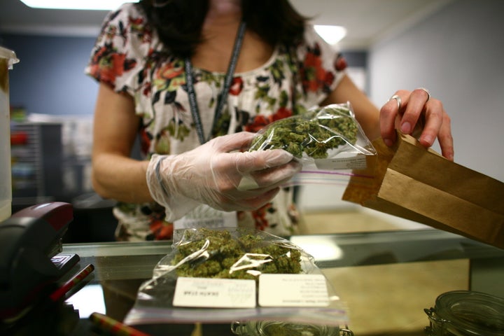 Lakewood, CO - MARCH, 4: Sales associate, Crystal Guess packages up a patient's cannabis inside a Good Meds medical cannabis center in Lakewood, Colorado, U.S., on Monday, March 4, 2013. This is at a Good Meds medical cannabis center in Lakewood, and is one of the facilities that Kristi Kelly, Co-Founder of Good Meds Network, operates. (Photo by Matthew Staver/For The Washington Post via Getty Images)