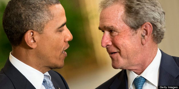 US President Barack Obama (L) and former President George W. Bush talk during a portrait unveiling ceremony in the East Room of the White House on May 31, 2012 in Washington, DC. President Obama and First Lady Michelle Obama hosted Bush and his wife Laura Bush to unveil their official White House portrait. AFP PHOTO/Brendan SMIALOWSKI (Photo credit should read BRENDAN SMIALOWSKI/AFP/GettyImages)