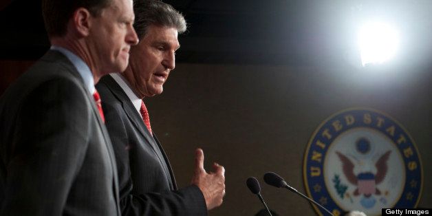 UNITED STATES - APRIL 10: Sen. Pat Toomey, R-Pa., and Sen. Joe Manchin, D-W.V., speak at a press conference about their bi-partisan agreement to propose legislation to strengthen background checks to prevent criminals and those with mental illness from buying guns. (Photo By Chris Maddaloni/CQ Roll Call)