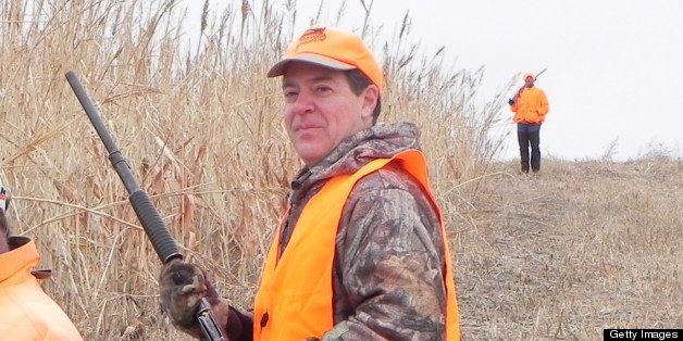 Kansas Gov. Sam Brownback, right, and guide Troy Sporer waited for other hunters before heading into cover during the Kansas Governor's Ringneck Classic in western Kansas. (Brent Frazee/Kansas City Star/MCT via Getty Images)