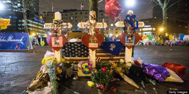 BOSTON - APRIL 24: The makeshift memorial in Copley Square photographed after Boylston Street was reopened to the public at a