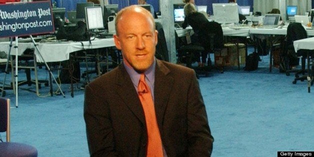 UNITED STATES - JULY 26: REAL-TIME NEWSPAPER/DEMOCRATIC NATIONAL CONVENTION--Washington Post staff reporter Mark Leibovich during a live shot on washingtonpost.com, in the Washington Post work space in the press pavilion. Print side editors and reporters work in the background. (Photo by Scott J. Ferrell/Congressional Quarterly/Getty Images)