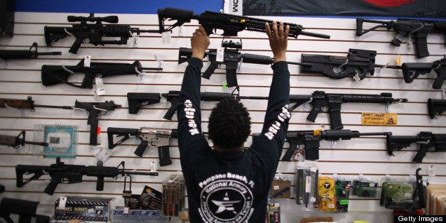 POMPANO BEACH, FL - APRIL 11: As the U.S. Senate takes up gun legislation in Washington, DC , Mike Acevedo puts a weapon on display at the National Armory gun store on April 11, 2013 in Pompano Beach, Florida. The Senate voted 68-31 to begin debate on a bill that would significantly expand background checks for gun sales. (Photo by Joe Raedle/Getty Images)