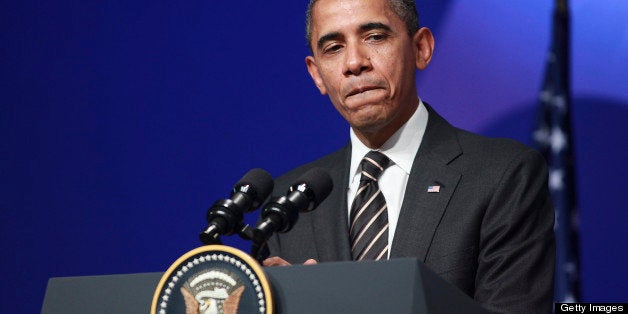 U.S. President Barack Obama pauses during a news conference following the Group of 20 (G20) Cannes Summit at the Palais des Festivals, in Cannes, France, on Friday, Nov. 4, 2011. Obama said leaders of the Group of 20 nations have made 'important progress' toward putting the global economic recovery on firmer footing even as growth in the U.S. remains too slow. Photographer: Chris Ratcliffe/Bloomberg via Getty Images 