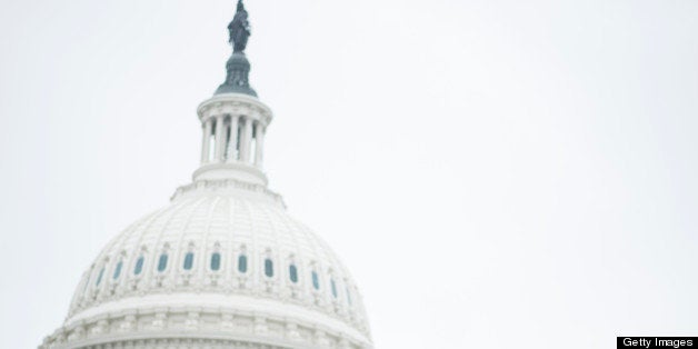 UNITED STATES - MARCH 25: A tourist stands atop the the stairs from the Capitol Visitor Center to the East Plaza of the Capitol as a mix of light rain and snow falls on Monday, March 25, 2013. (Photo By Bill Clark/CQ Roll Call)