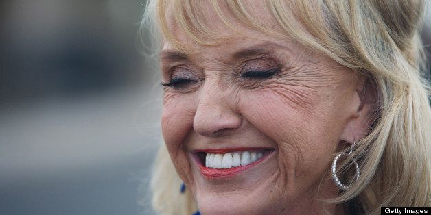 GLENDALE, AZ - FEBRUARY 28: Arizona Gov. Jan Brewer leaves a polling station after voting in the Republican presidential primary February 28, 2012 in Glendale, Arizona. Arizona is a winner take all state, with all the delegates from the state going to the winner of the primary. Early voting began in the state February 2, with over 300, 000 votes already cast as of February 27. (Photo by Jonathan Gibby/Getty Images)