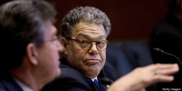 WASHINGTON, DC - MARCH 21: U.S. Sen. Al Franken (D-MN) (R) listens as U.S. Sen. Joe Manchin (L) (D-WV) speaks during a markup meeting of the Senate Energy and Natural Resources Committee March 21, 2013 in Washington, DC. The committee met to vote on the nomination of Sarah Jewell for the position of Secretary of the Interior. (Photo by Win McNamee/Getty Images)
