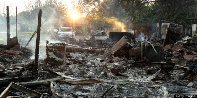 WEST, TX - APRIL 18: Smoke still rises from the rubble of a housenext to the fertilizer plant that exploded yesterday afternoon on April 18, 2013 in West, Texas. According to West Mayor Tommy Muska, around 14 people, including 10 first responders, were killed and more than 150 people were injured when the fertilizer company caught fire and exploded, leaving damaged buildings for blocks in every direction. (Photo by Erich Schlegel/Getty Images)