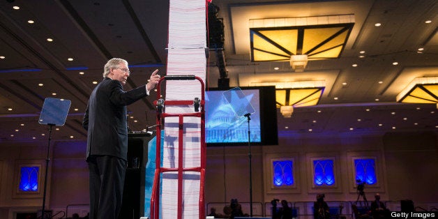 UNITED STATES - MARCH 15: Senate Minority Leader Mitch McConnell, R-Ky., speaks next to a tower of 20,000 pages of health care rules and regulations at the 2013 Conservative Political Action Conference at the Gaylord National Resort & Conference Center at National Harbor, Md., on Friday, March 15, 2013. (Photo By Bill Clark/CQ Roll Call)