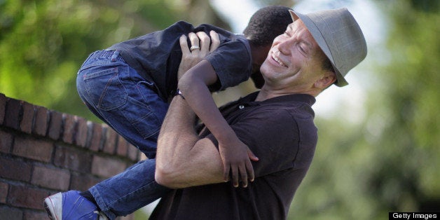 MIAMI - SEPTEMBER 22: Frank Martin Gill plays with his six-year-old foster son, known as N.R.G., after the Third District Court of Appeal in Miami ruled earlier today that Florida's ban on gays adopting is unconstitutional on September 22, 2010 in Miami, Florida. The decision will allow Gill, who sued to have the law overturned, and his partner to keep the two children they adopted and may be the first step in overturning the state of Florida's 33-year-old law banning adoption by gay men and lesbians. (Photo by Joe Raedle/Getty Images)