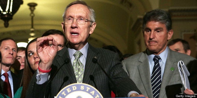 WASHINGTON, DC - APRIL 17: U.S. Senate Majority Leader Sen. Harry Reid (D-NV) (2nd R) speaks as Sen. Charles Schumer (D-NY) (L), Sen. Richard Blumenthal (D-CT) (3rd L), Sandy Hook victim Vicki Soto's sister Carlee Soto (2nd L), Sandy Hook victim Dawn Hochsprung's daughter Erica Lafferty (4th L) and Sen. Joe Manchin (D-WV) (R) listen during a news briefing after a vote on the Senate floor April 17, 2013 on Capitol Hill in Washington, DC. The Senate has defeated a bipartisan proposal by Sens. Joe Manchin (D-WV) and Pat Toomey (R-PA) to expand background checks on firearms purchases and close the so-called gun show loophole. (Photo by Alex Wong/Getty Images)