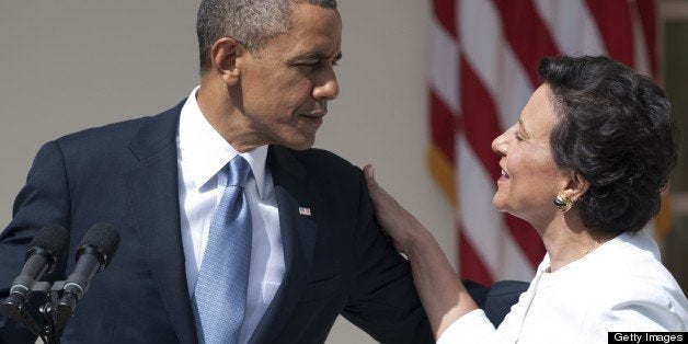 US President Barack Obama embraces his nominee for Secretary of Commerce, Penny Pritzker, during an event in the Rose Garden