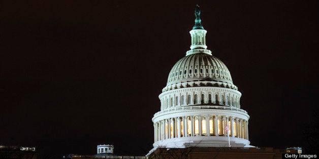 The dome of the U.S. Capitol is lit up in the evening in Washington, D.C., U.S., on Thursday, Feb. 28, 2013. Democrats and Re