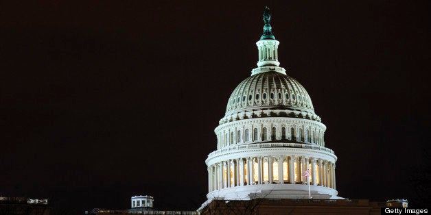 The dome of the U.S. Capitol is lit up in the evening in Washington, D.C., U.S., on Thursday, Feb. 28, 2013. Democrats and Republicans are in a standoff over how avert $85 billion in federal spending cuts set to start before midnight on March 1. Photographer: Pete Marovich/Bloomberg via Getty Images